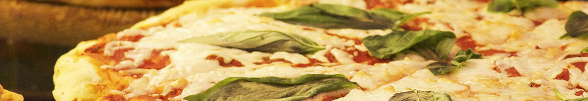 Eating Italian Pizza at Vito's Pizza & Ristorante restaurant in Alpharetta, GA.